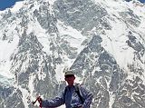 18 Jerome Ryan At Nanga Parbat Rupal Face Base Camp Jerome Ryan poses at Nanga Parbat Rupal Face Herligkoffer Base Camp with the awesome Rupal Face behind.